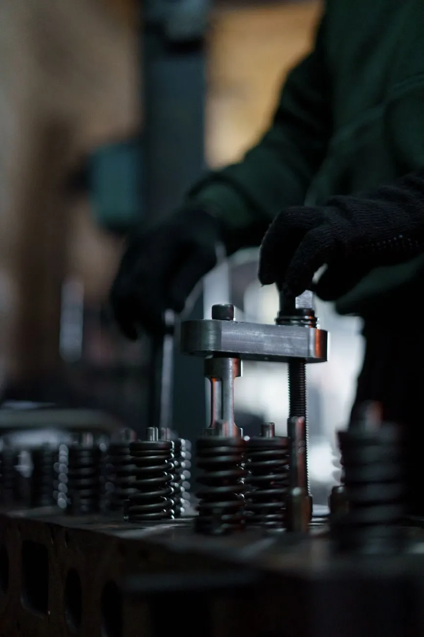 Valve springs on a cylinder head on the workshop bench